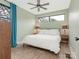 Serene bedroom features a ceiling fan, a large window and hardwood floors at 1921 Union St, Charlotte, NC 28205