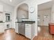 Kitchen with stainless steel dishwasher and arched doorway to dining room at 1921 Union St, Charlotte, NC 28205