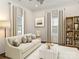 Cozy living room with neutral tones, modern decor, and bright windows at 1921 Union St, Charlotte, NC 28205