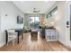 Open living room with large windows, neutral color palette, and wood flooring at 1921 Union St, Charlotte, NC 28205