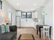 Bright living space open to kitchen with stainless steel appliances and a large window at 1921 Union St, Charlotte, NC 28205
