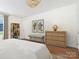 Bright main bedroom featuring hardwood floors, neutral walls, a ceiling fan, and two windows at 1921 Union St, Charlotte, NC 28205