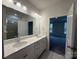 Bright bathroom with double vanity, modern lighting, and a glass-enclosed shower at 2036 Skyhawk Dr, York, SC 29745
