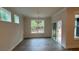 Bright dining room area featuring wood-look floors and large windows at 2036 Skyhawk Dr, York, SC 29745