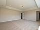 Bright bedroom with neutral carpet, recessed lighting, and door leading to hallway at 2211 Camber Dr # Cwo0103, Gastonia, NC 28054