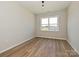 A simple bedroom featuring hardwood floors and a sun-lit window at 2211 Camber Dr # Cwo0103, Gastonia, NC 28054