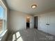 Bright bedroom with natural light, view of bathroom entrance and double closets at 2211 Camber Dr # Cwo0103, Gastonia, NC 28054