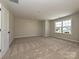 Spacious bedroom with neutral walls, carpet, and natural light, creating a serene atmosphere at 2211 Camber Dr # Cwo0103, Gastonia, NC 28054