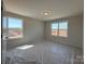 Bedroom featuring two large windows, neutral walls, and ample natural light at 2211 Camber Dr # Cwo0103, Gastonia, NC 28054