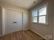 Bedroom showcases closet with wood-style floors and natural light from the window at 2211 Camber Dr # Cwo0103, Gastonia, NC 28054