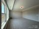 Large primary bedroom featuring a tray ceiling and large windows for natural light at 2211 Camber Dr # Cwo0103, Gastonia, NC 28054