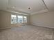 Spacious bedroom with large window offering natural light, neutral carpet, and recessed lighting at 2211 Camber Dr # Cwo0103, Gastonia, NC 28054
