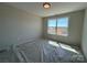 Bright bedroom featuring a large window, neutral walls, and ample natural light at 2211 Camber Dr # Cwo0103, Gastonia, NC 28054