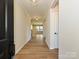 Inviting foyer with wood flooring and elegant lighting fixtures at 2211 Camber Dr # Cwo0103, Gastonia, NC 28054