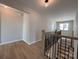 Hallway featuring a stairway, modern railing and natural light at 2211 Camber Dr # Cwo0103, Gastonia, NC 28054
