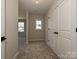 Hallway features neutral colors, plush carpeting, and natural light with two large closets at 2211 Camber Dr # Cwo0103, Gastonia, NC 28054