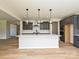 Modern kitchen featuring an island, stainless steel appliances, and gray cabinetry at 2211 Camber Dr # Cwo0103, Gastonia, NC 28054