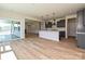 Open-concept kitchen featuring a central island, hardwood floors, and stainless appliances at 2211 Camber Dr # Cwo0103, Gastonia, NC 28054