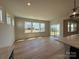 Bright and airy living space featuring large windows and an adjacent modern kitchen area at 2211 Camber Dr # Cwo0103, Gastonia, NC 28054