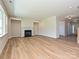 This spacious living area with hardwood floors features a fireplace and architectural details at 2211 Camber Dr # Cwo0103, Gastonia, NC 28054