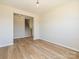 The living room features hardwood floors and flows into the hall and staircase at 2211 Camber Dr # Cwo0103, Gastonia, NC 28054