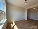 Sunlit room with luxury vinyl plank flooring and an open doorway to the hallway at 2211 Camber Dr # Cwo0103, Gastonia, NC 28054