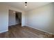 Spacious living room with luxury vinyl flooring and a view of the home's staircase at 2211 Camber Dr # Cwo0103, Gastonia, NC 28054