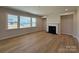 Comfortable living room with hardwood floors, a classic fireplace, and large windows that offer great natural light at 2211 Camber Dr # Cwo0103, Gastonia, NC 28054