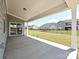 Covered patio with views of a fenced yard and neighboring homes at 2211 Camber Dr # Cwo0103, Gastonia, NC 28054