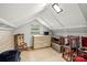 Cozy attic space with natural light from the skylight and dormer window at 225 Institute St, Mooresville, NC 28115