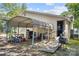 Spacious carport with sheltered parking, offering a convenient outdoor work and storage area at 225 Institute St, Mooresville, NC 28115