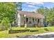 Adorable single-Gathering home with a well-kept lawn, charming front porch, and traditional siding at 225 Institute St, Mooresville, NC 28115