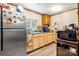 Well-lit kitchen with stainless steel refrigerator and ample counter space, ideal for meal preparation at 225 Institute St, Mooresville, NC 28115