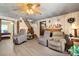 Cozy living room featuring a fireplace and easy access to other rooms and the stairs at 225 Institute St, Mooresville, NC 28115