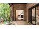 Back porch with views of surrounding nature, trees, and landscaping at 225 Riverton Rd, Weddington, NC 28104