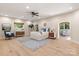 Spacious bedroom featuring hardwood floors, a ceiling fan, and sitting areas at 225 Riverton Rd, Weddington, NC 28104