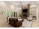 Inviting living room with a cozy seating area, a stone fireplace, and patio access at 225 Riverton Rd, Weddington, NC 28104