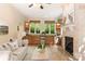 Comfortable living room with fireplace, built in wet-bar with granite counters, and an abundance of natural light at 225 Riverton Rd, Weddington, NC 28104