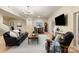 Spacious living area with comfortable seating, a large rug, and plenty of natural light, ideal for relaxation and gatherings at 225 Riverton Rd, Weddington, NC 28104