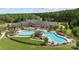 Aerial view showcasing a community pool, clubhouse, and beautifully landscaped grounds at 3288 Sherman Dr, Lancaster, SC 29720