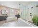 Elegant bathroom with a soaking tub, separate glass-enclosed shower, and modern fixtures at 3288 Sherman Dr, Lancaster, SC 29720