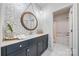 Stylish bathroom featuring hexagon tiles, a large mirror, and a modern vanity with grey cabinets at 3288 Sherman Dr, Lancaster, SC 29720