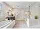 Elegant bathroom with a soaking tub, separate glass-enclosed shower, and stylish fixtures at 3288 Sherman Dr, Lancaster, SC 29720