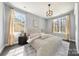 Serene bedroom with soft lighting, neutral tones, large windows, and plush rug at 3288 Sherman Dr, Lancaster, SC 29720