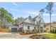 Charming two-story home with a three car garage, stone accents, and a beautifully landscaped front yard at 3288 Sherman Dr, Lancaster, SC 29720