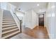 Bright foyer with hardwood floors, white trim, and staircase leading to the upper level at 3288 Sherman Dr, Lancaster, SC 29720