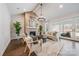 Inviting living room with a brick fireplace, vaulted ceilings, and access to the outdoor patio at 3288 Sherman Dr, Lancaster, SC 29720
