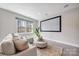 Cozy living room featuring a comfortable couch, natural light, and a large movie screen for entertainment at 3288 Sherman Dr, Lancaster, SC 29720