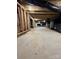 Unfinished basement featuring cement floor, exposed ceiling, and plumbing at 32884 Old Salisbury Rd, Albemarle, NC 28001