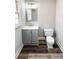 Updated bathroom with modern vanity and fixtures, new toilet, and decorative flooring at 32884 Old Salisbury Rd, Albemarle, NC 28001